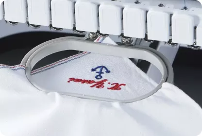 White embroidered handkerchief in small oval frame